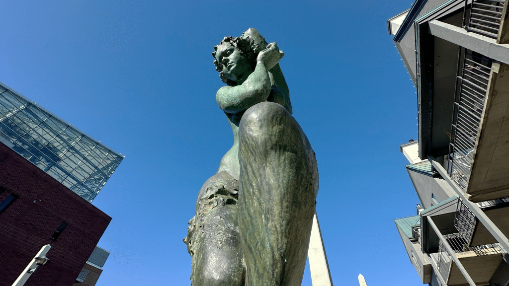 Spring by David Akhriev. This bronze sculpture is part of a four part series titled 'Four Seasons'. Located at the southend of Market Street Bridge.